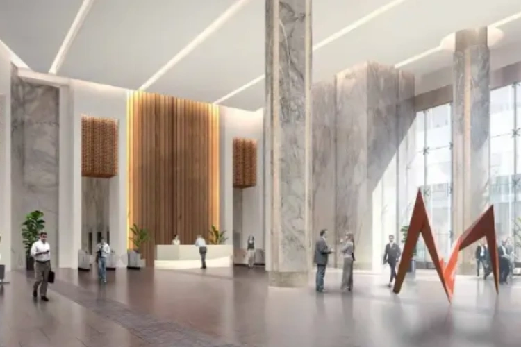 Luxurious office or hotel lobby with marble pillars and art installation.