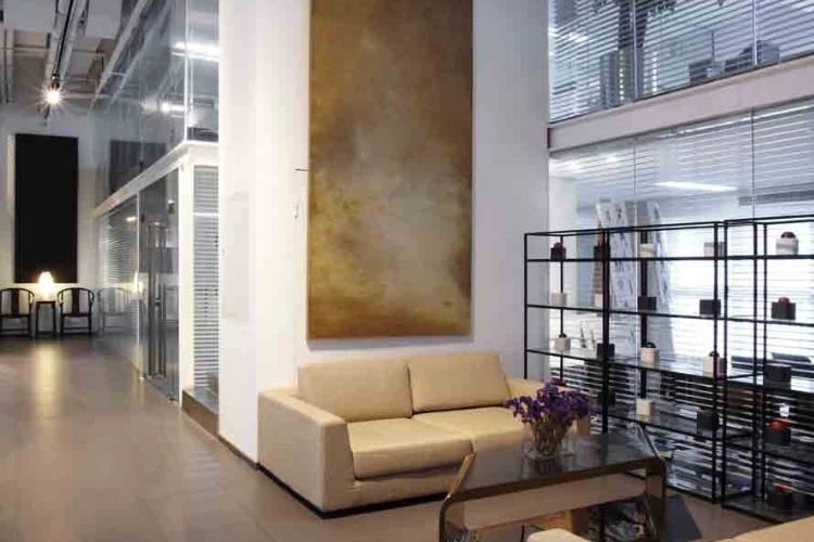 Modern Office Lounge with Sofa and Bookshelf