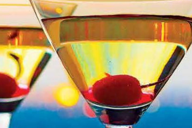 Cocktails with Cherry Garnish at Sunset