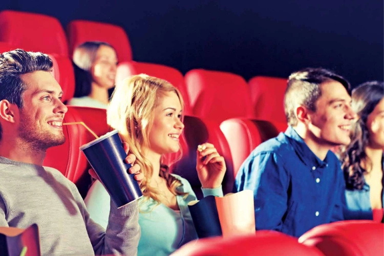 Group of Friends Enjoying Movie in Cinema Hall